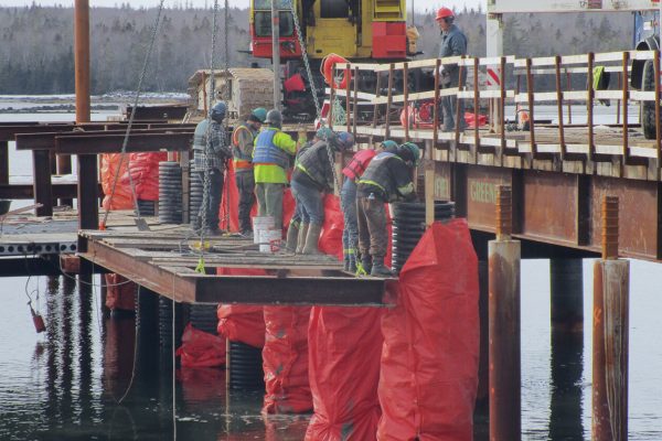 Waterside view of construction in progress at East Side Port L'Hébert Harbour. SHM Canada's resident construction inspector is supporting the redevelopment of this active fishing harbour in Queens County, NS.